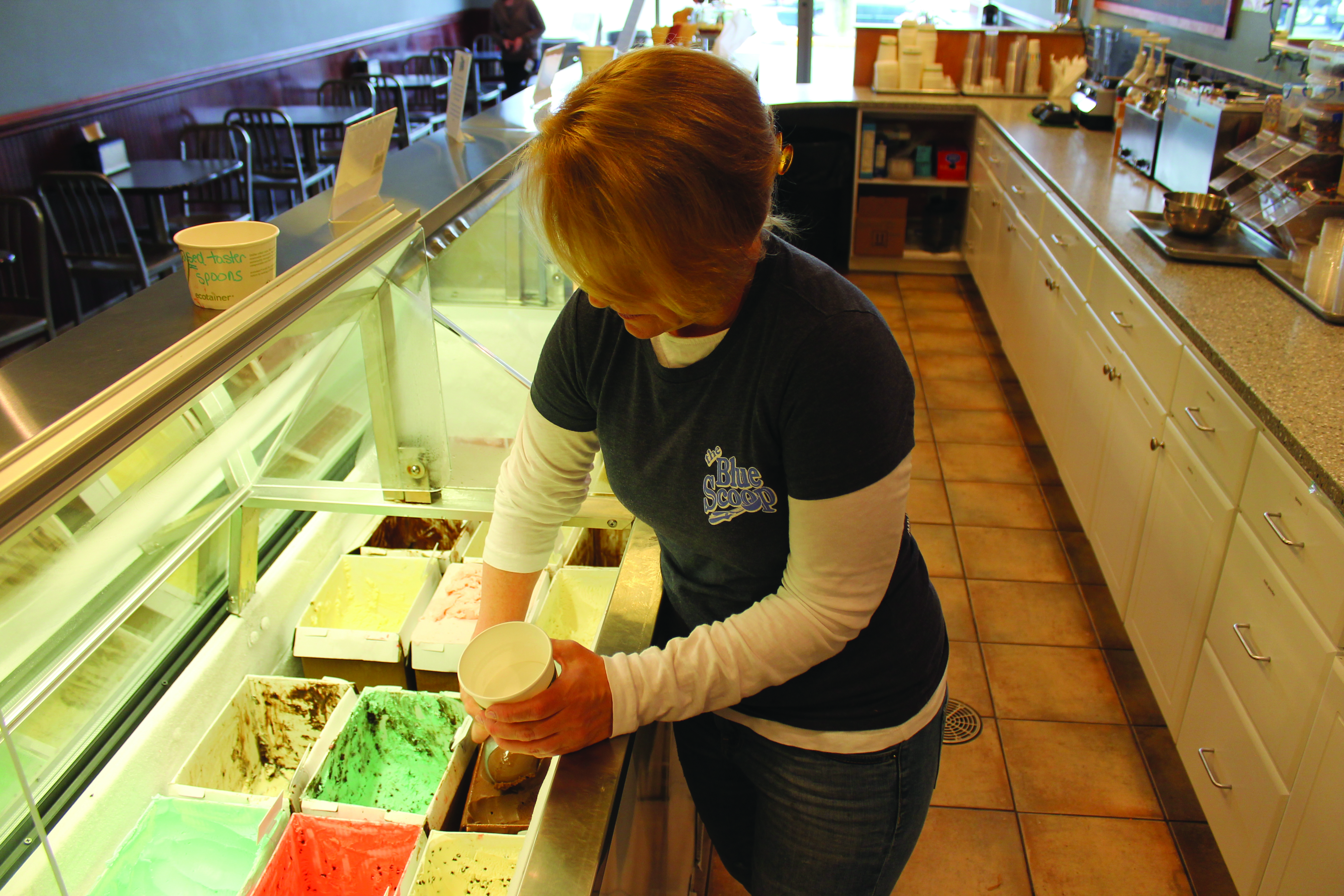Schuckman scoops up ice cream for a customer.