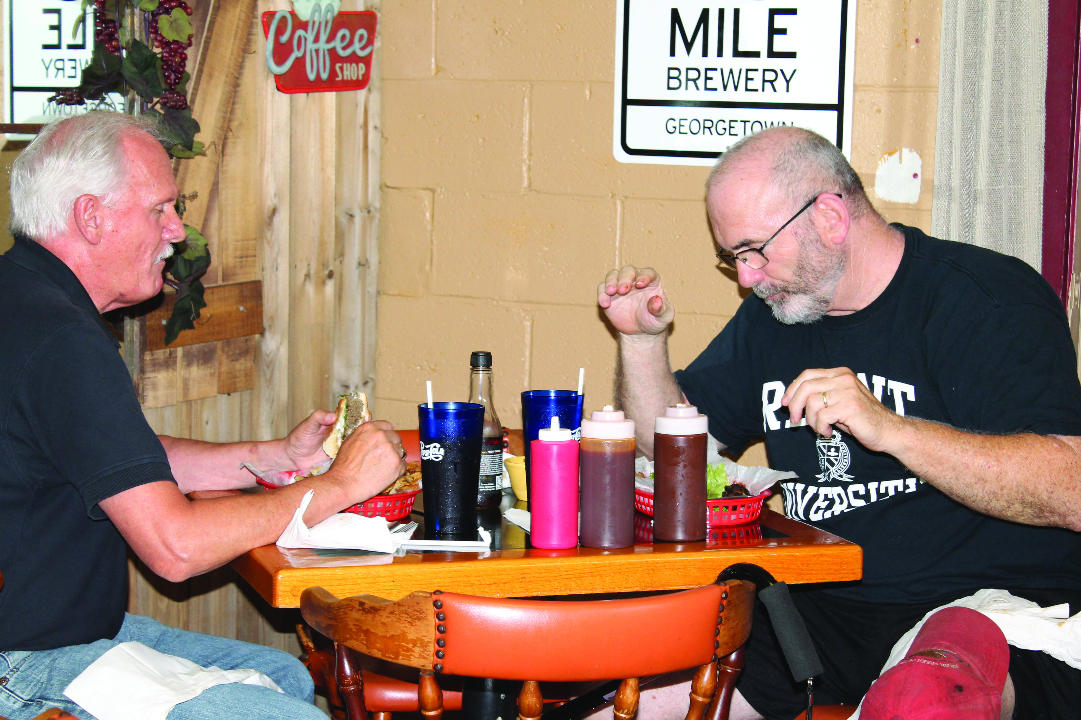 Customers chat while enjoying their homemade lunch.