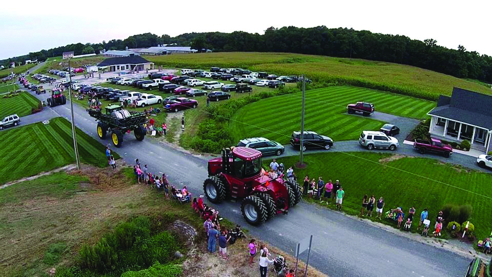The Good Ole Boy Foundation puts on a tractor parade to fulfill a sick child’s wish to drive a tractor.