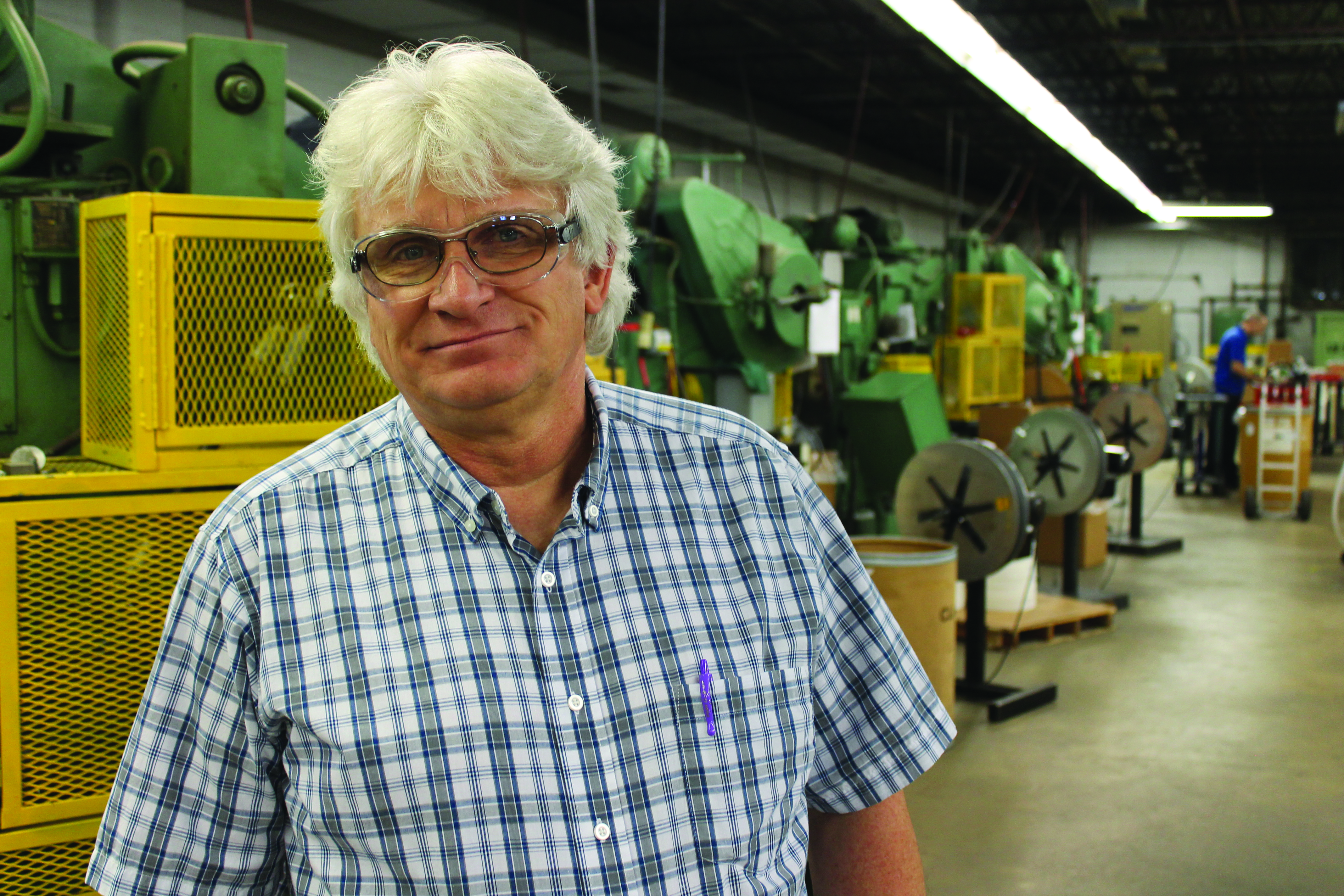 Owner Carl Peters stands in the main press room at the Greenwood plant. 