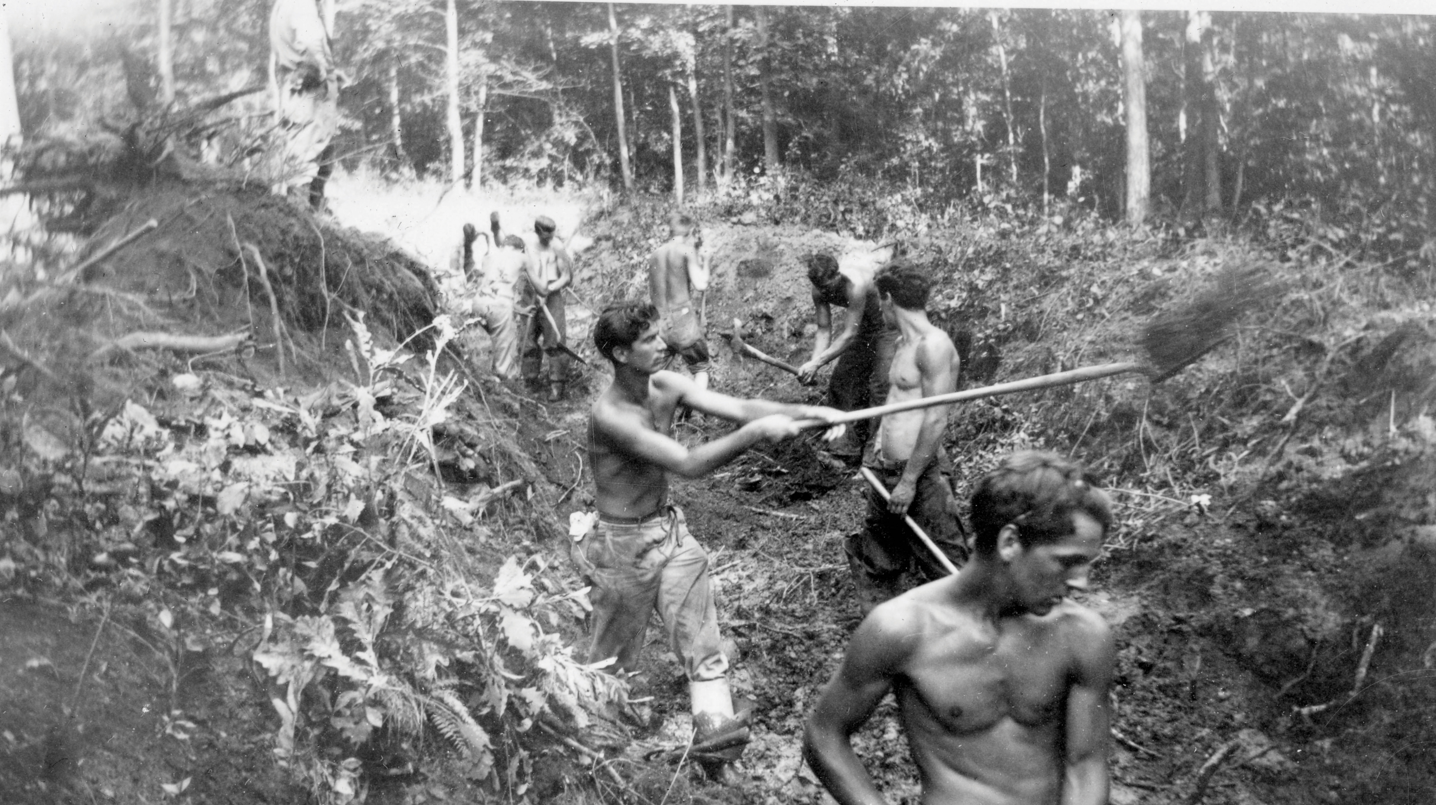 Men with the Wyoming Camp clear a ditch after a dynamite blast in  Kent County.