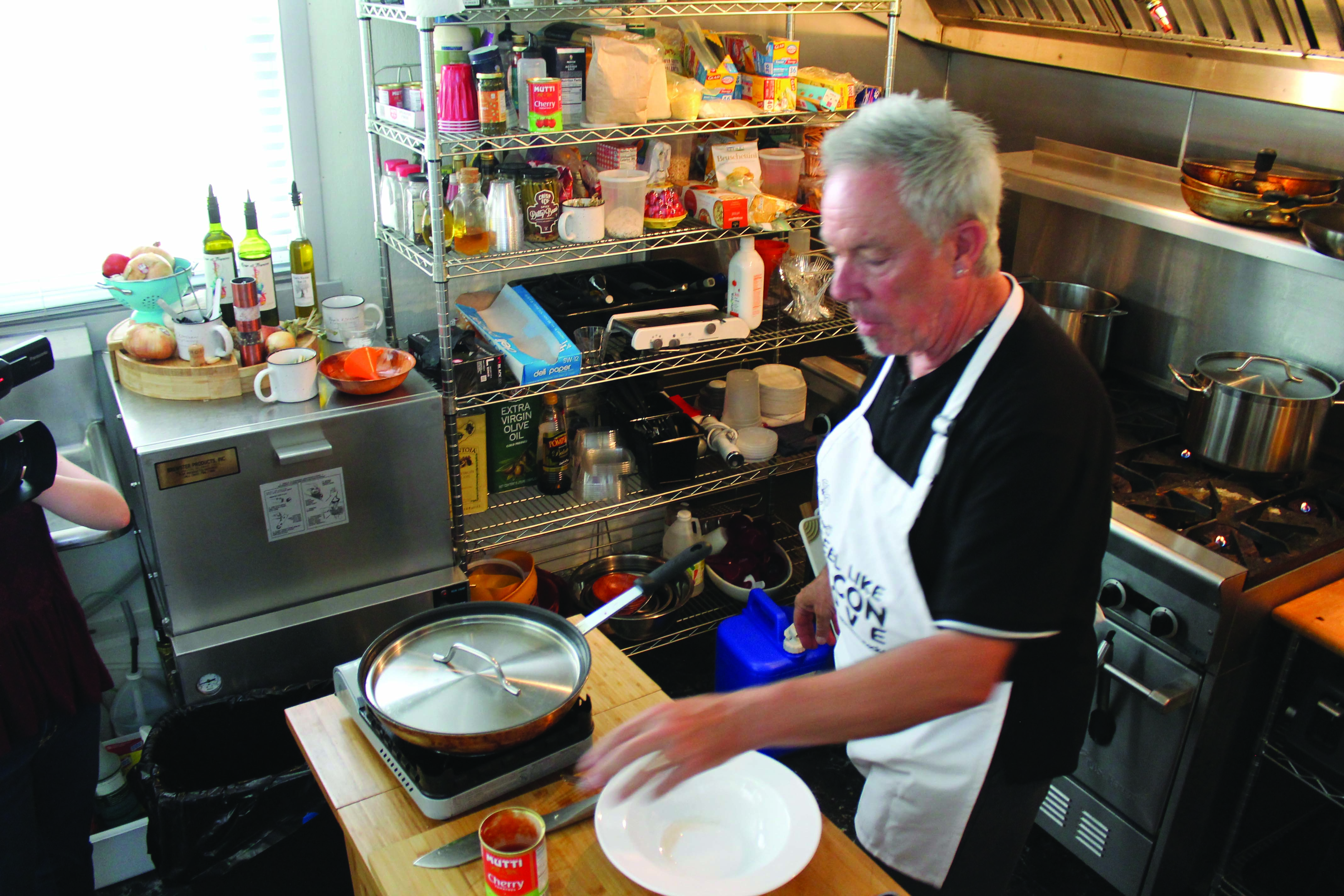 Cullen preps for a cooking demonstration in his kitchen.