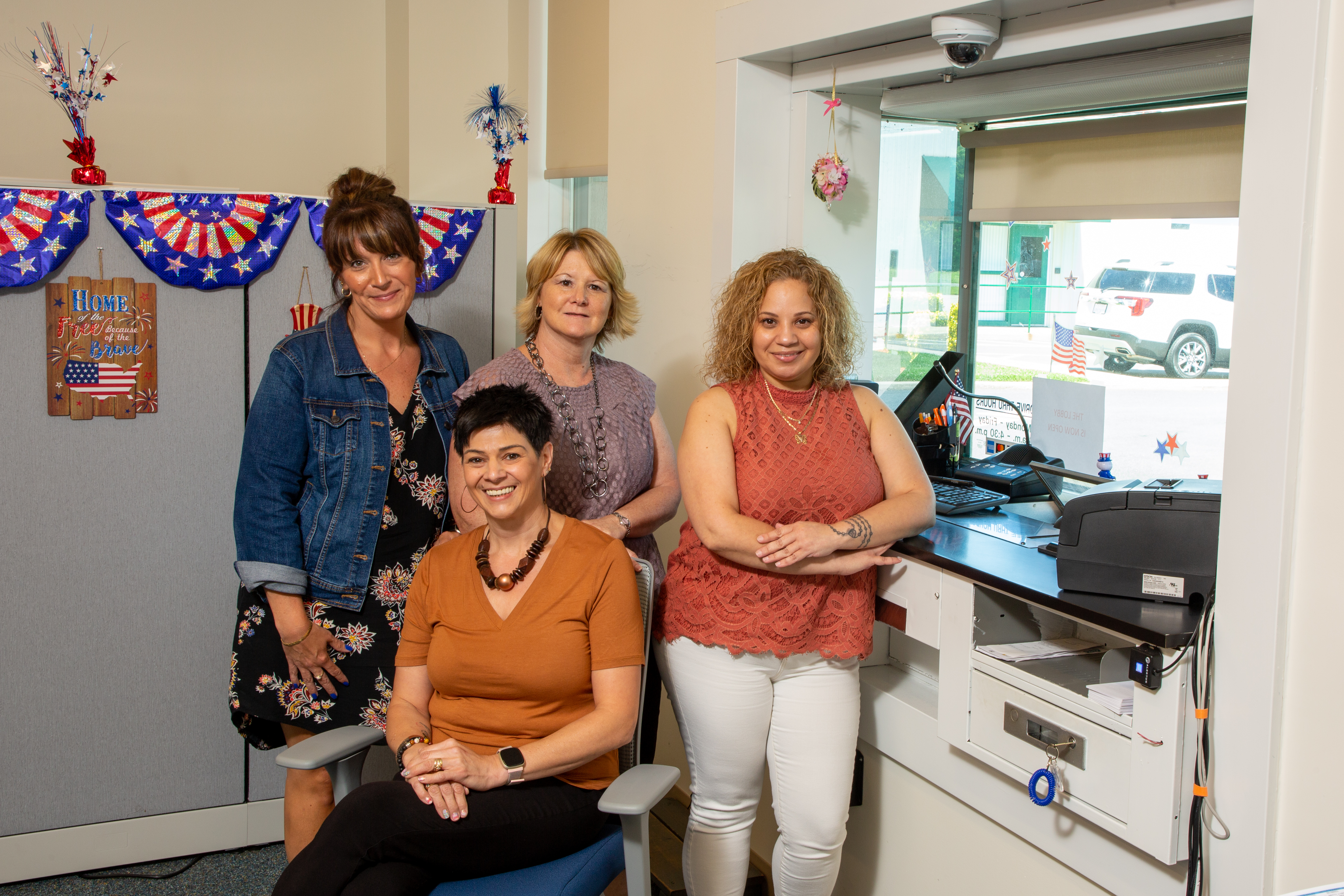(From left to right) Sarah Boothe, Susan Hofstetter, Andrea Bush (seated) and Meriam Arocho make up DEC's payment processing department.