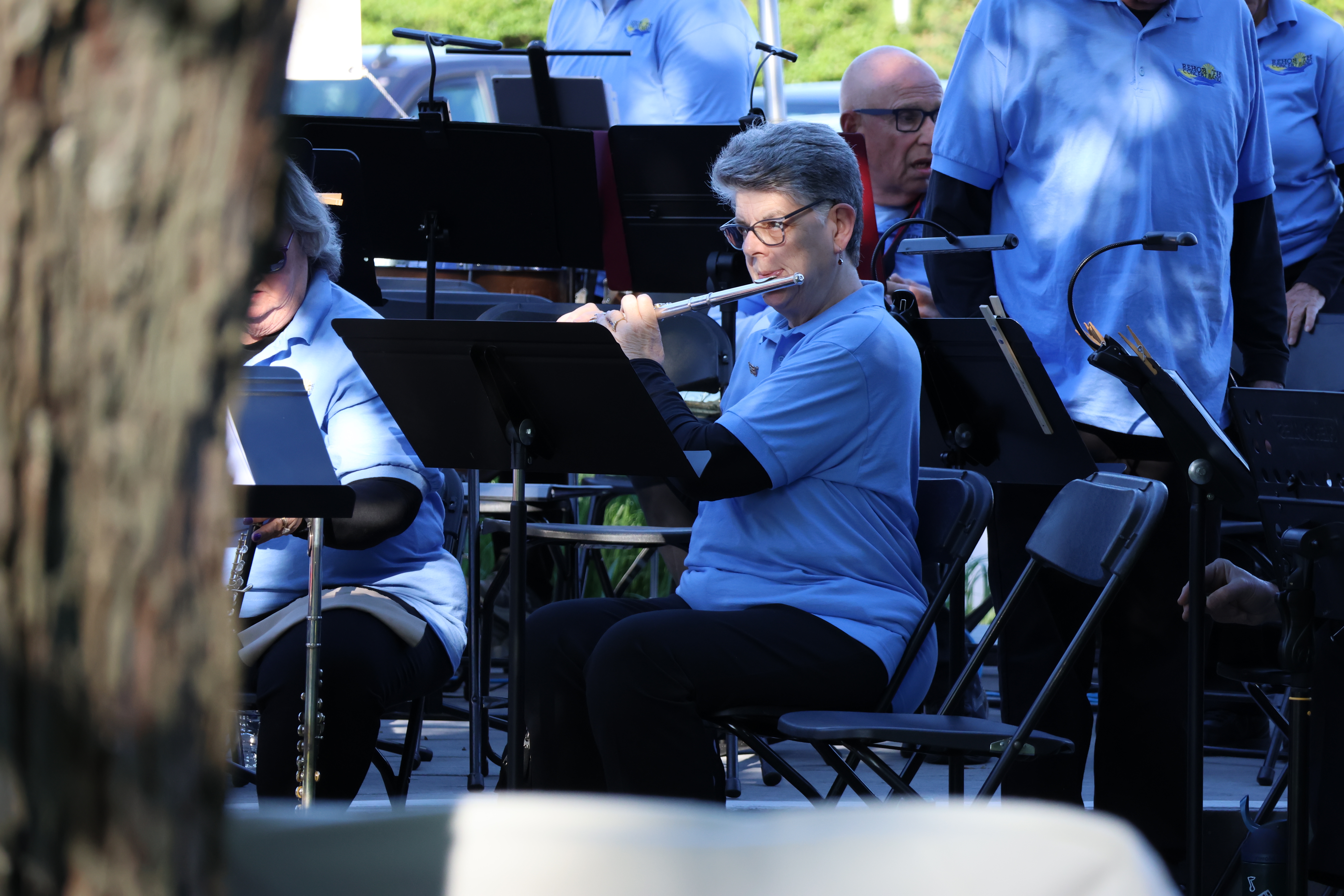 Dianne Deming — the band's current board president — warms up ahead of the band's performance.