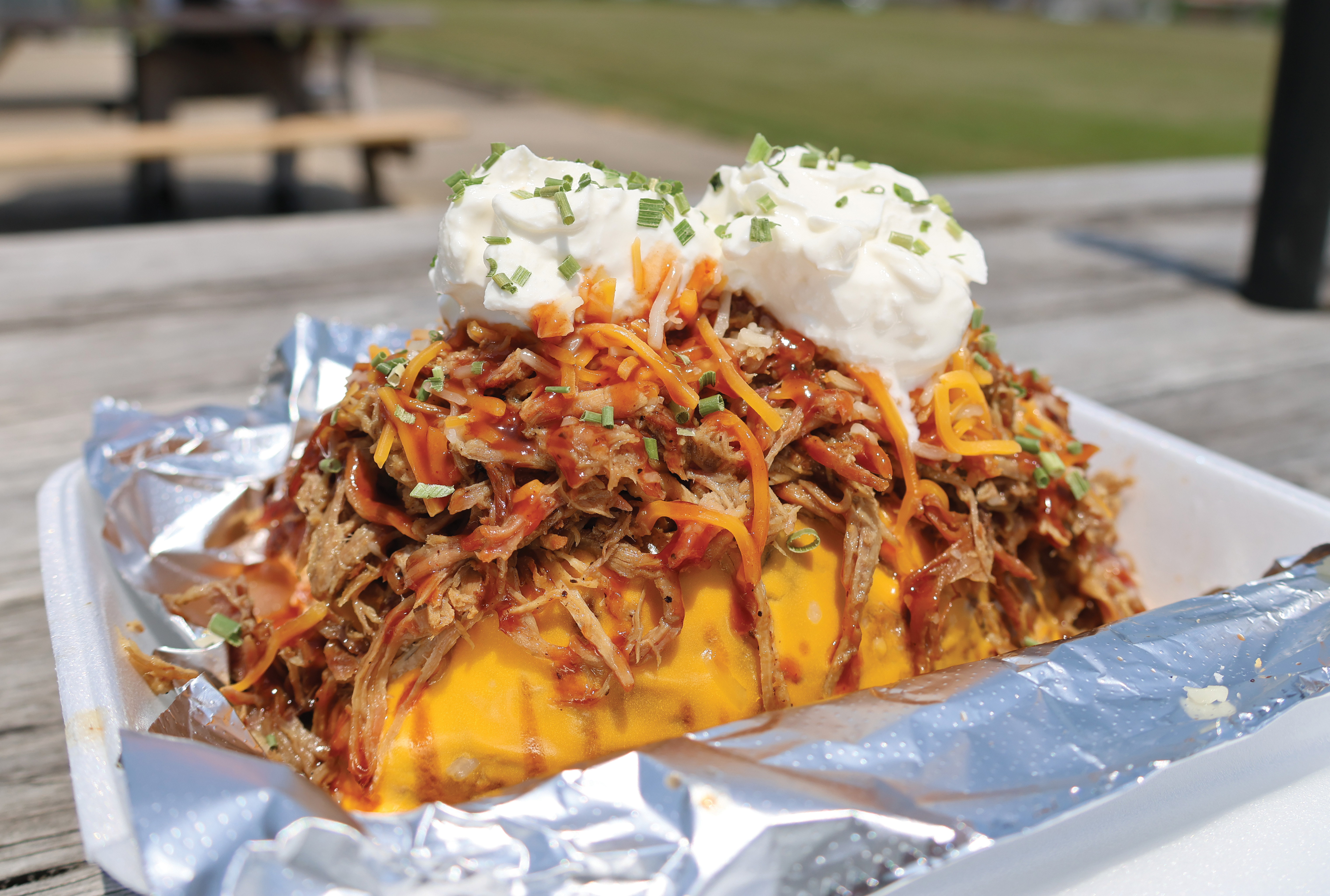 One of Pit Daddy's most popular menu options is the Smokin' Spud — a baked potato loaded with a meat of your choice, cheese and sour cream.
