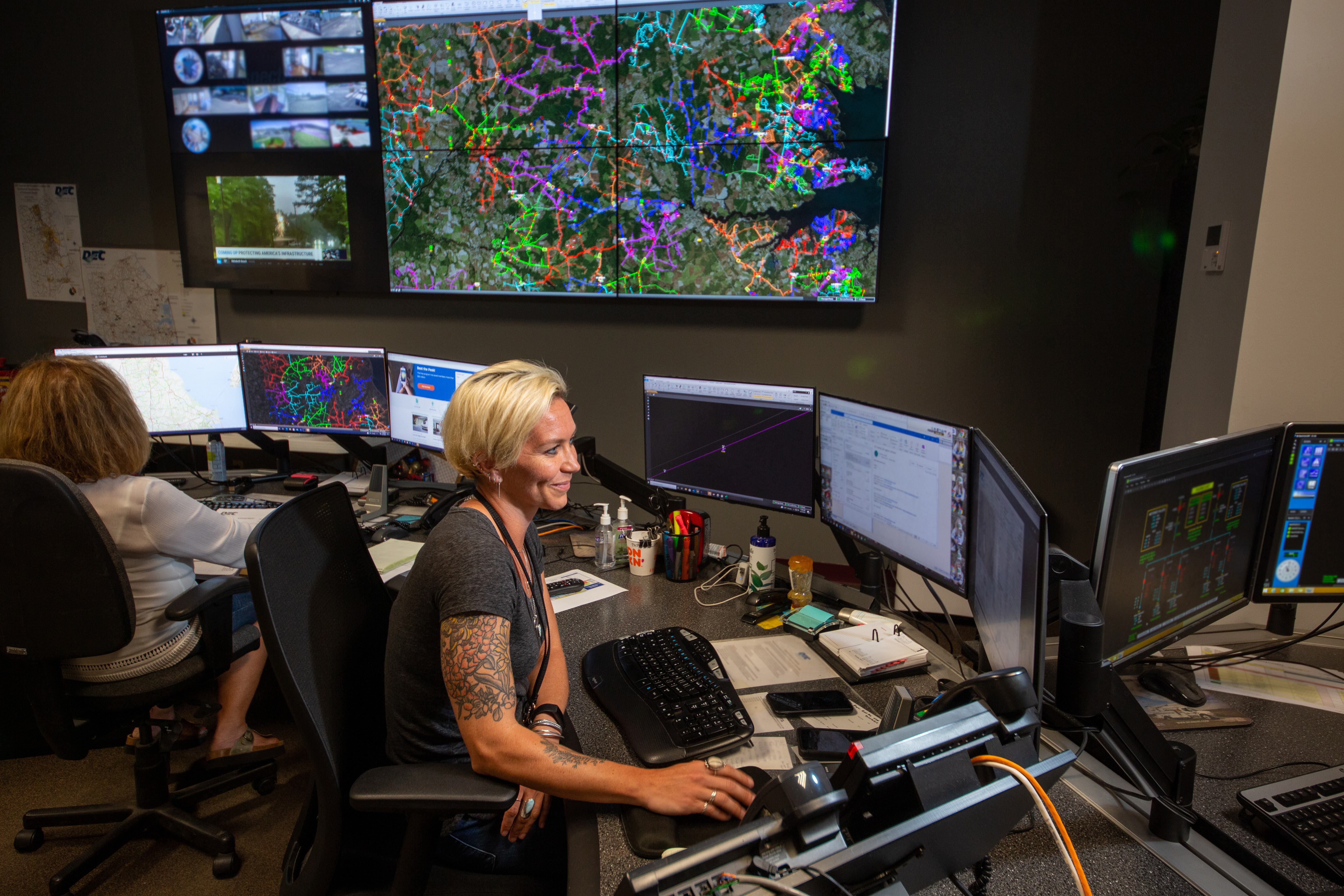 A DEC Dispatcher sits at their station in the Co-op's Dispatch center.