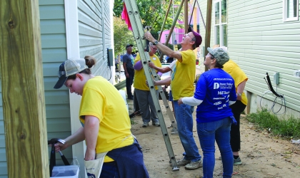 People working on house