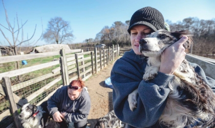 Woman holding dog