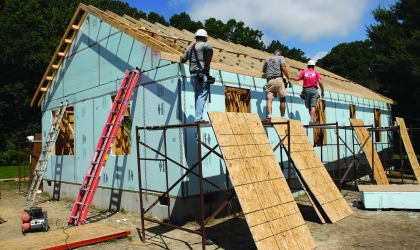 People building house