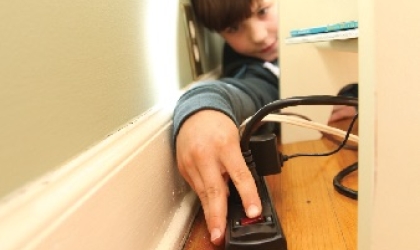 Boy with power strip