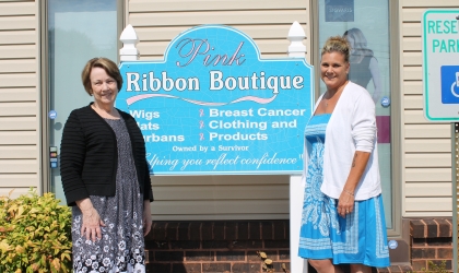 two ladies by sign