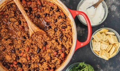 Chili in pot with side toppings