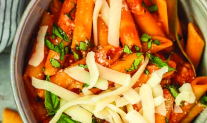 Bowl with orange carrots and cheese