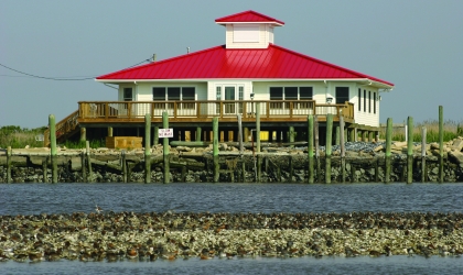 Red Roof Building on stilts over water