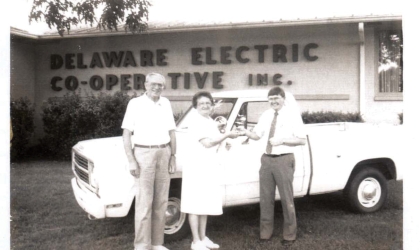 A photo from the DEC archives featuring a group of people outside the original Co-op building.