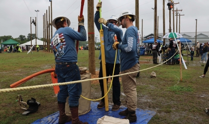 DEC lineworkers compete at last year's Gaff-n-Go Rodeo.