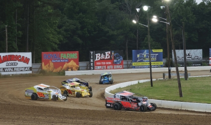 A group of stockcars round the track at Georgetown Speedway.