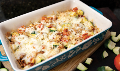 A pan of the Zucchini Chicken Bake displayed on a table.