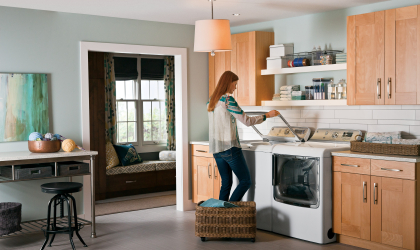 A woman unloads her washing machine