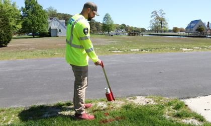 DEC Cable Locator Jackson Rall marks the location of underground electric lines.