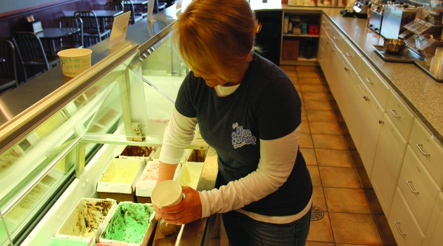 Lady dipping ice cream