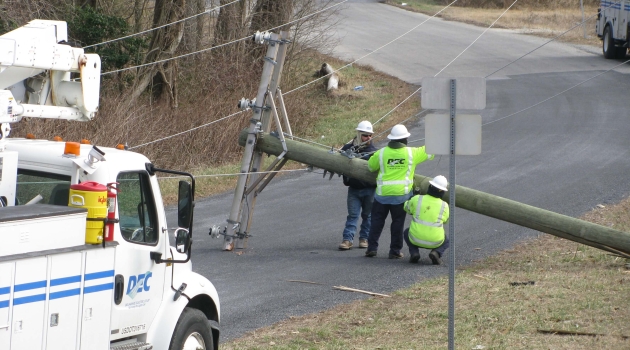 Linemen with broken pole
