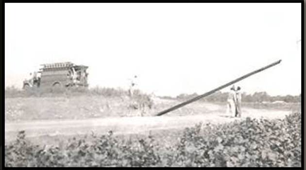 Men putting up electric pole