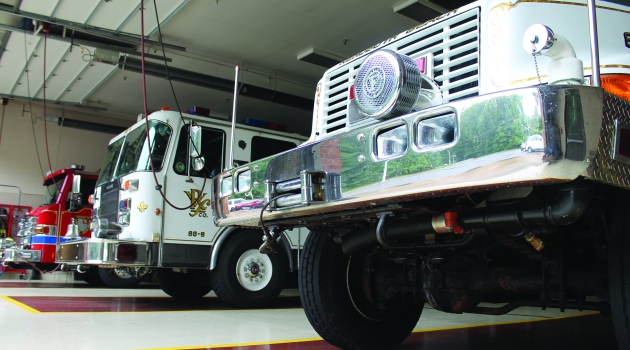 Firetrucks sitting in firehouse