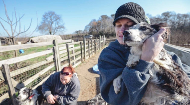 Woman holding dog
