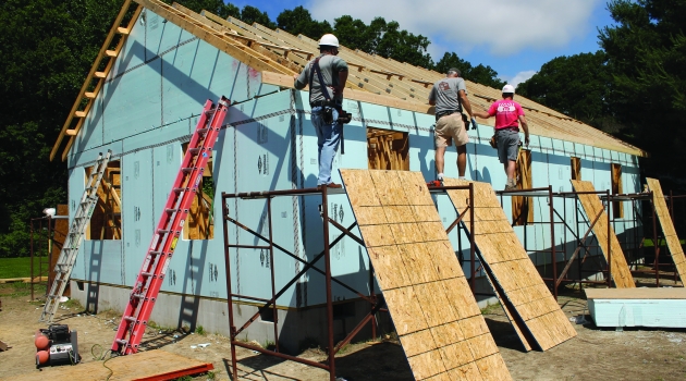 People building house