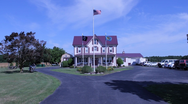House with blacktop driveway