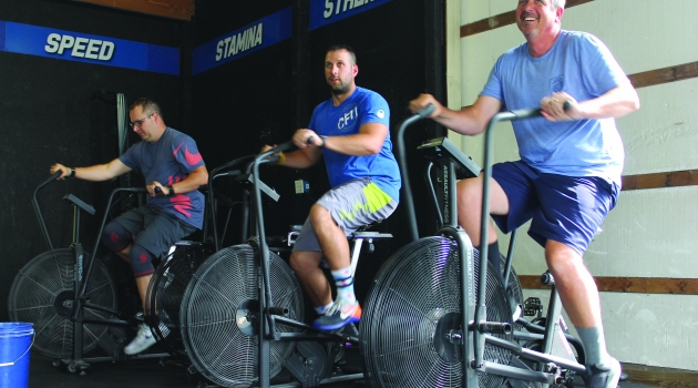 Men on exercise bikes