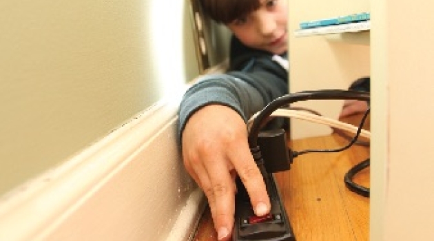 Boy with power strip