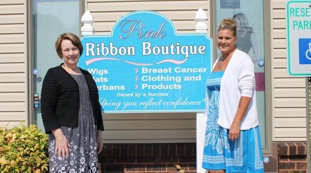 two ladies by sign