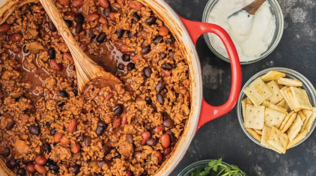 Chili in pot with side toppings