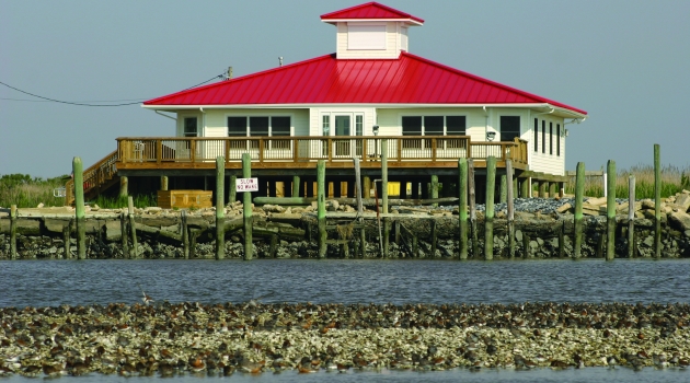 Red Roof Building on stilts over water