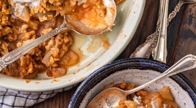 apple crisp in bowl with ice cream