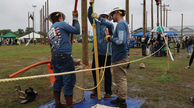 DEC lineworkers compete at last year's Gaff-n-Go Rodeo.