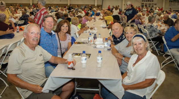 Attendees at DEC's annual meeting pose for a photo in Memorial Hall (formerly the Centre Ice Rink).