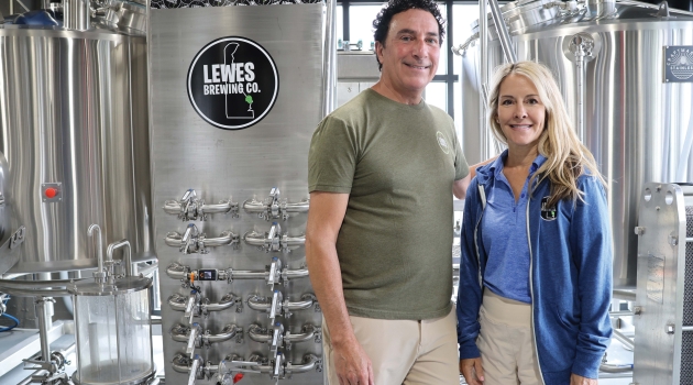 Dave and Christine Jones, owners of Lewes brewing Company, pose for a photo in the brewery.