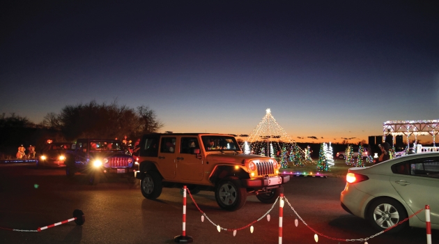 Visitors enjoy the light display from the comfort of their cars at the Drive-Thru Christmas on Merry Lane.