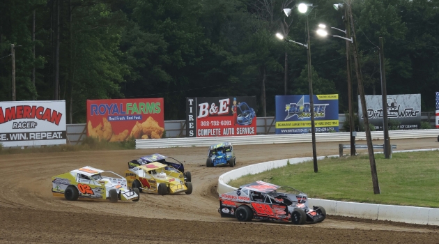 A group of stockcars round the track at Georgetown Speedway.