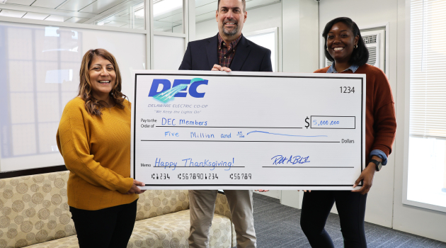 DEC’s Ivanessa Cay, Manager of Member Services, Rob Book, President &amp; CEO and Amber Cannon, Junior Accounting Clerk for Capital Credits and Payroll announce the return of $5 million to members.