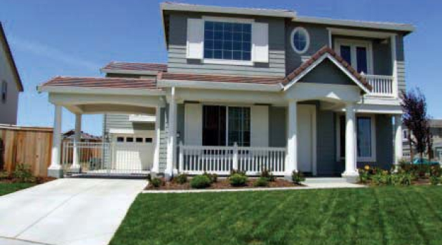 Photo of a two-story house on a neighborhood street