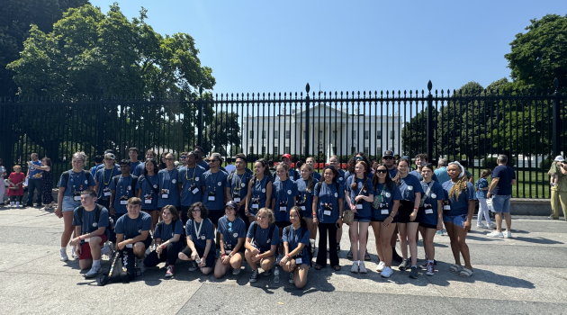 Students participating in Youth Tour pose for a photo in front of the White House.