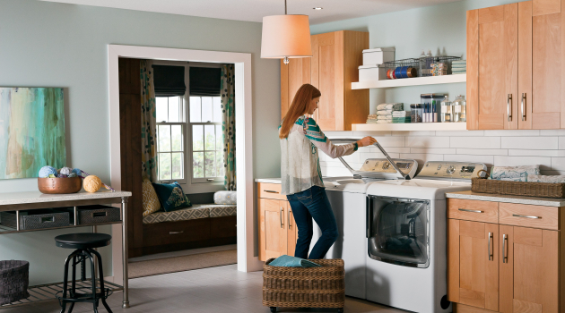 A woman unloads her washing machine