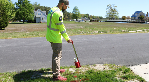 DEC Cable Locator Jackson Rall marks the location of underground electric lines.
